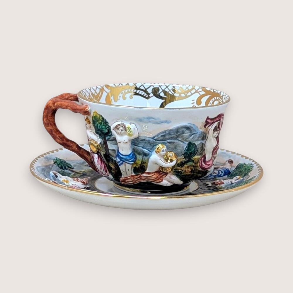 Mid 20th Century Italian Capodimonte Relief Figural Cup And Saucer